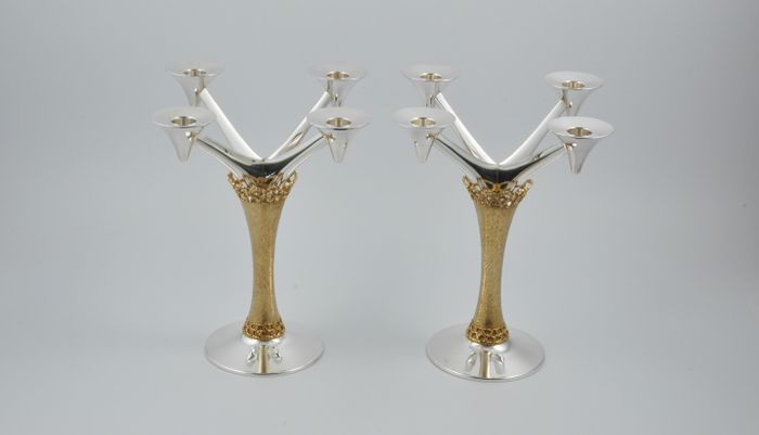 Pair of parcel gilt silver candelabra marked for London 1975 by Stuart Devlin.