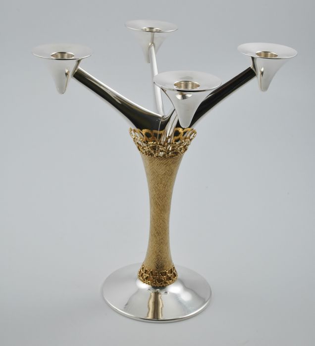 Pair of parcel gilt silver candelabra marked for London 1975 by Stuart Devlin.