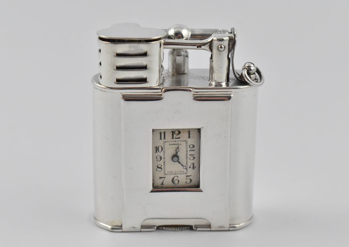 Art Deco sterling silver, single wheel Dunhill watch lighter. The watch signed ‘DUNHILL FAB. SUISSE’ and the case ‘ALFRED DUNHILL PARIS PAT. NO.143752’.