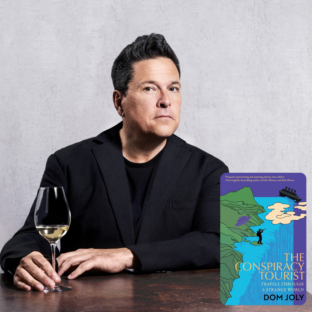 Dom Joly with book jacket