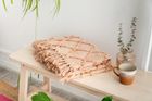 Textured dusty pink throw