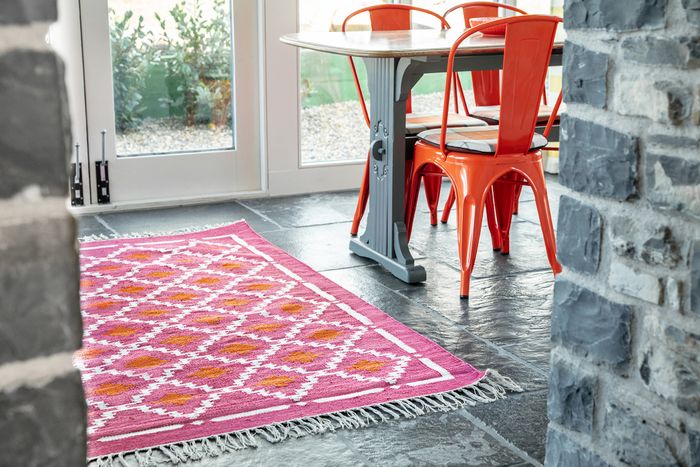 Cerise pink and orange handwoven rug