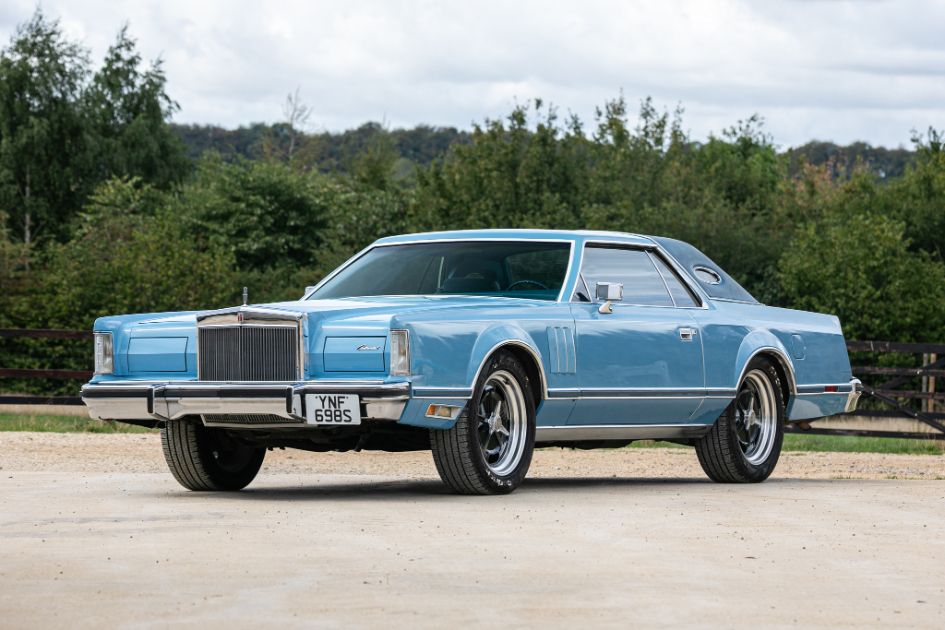 Front-three-quarter view of a light blue 1978 Lincoln Continental Mark V luxury coupe parked outdoors.
