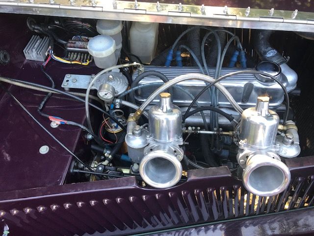 Engine bay of a custom-built purple Vincent MPH, a hand-built replica of a 1930s Riley, showcasing its tuned Kent X-Flow engine and SU carbs.