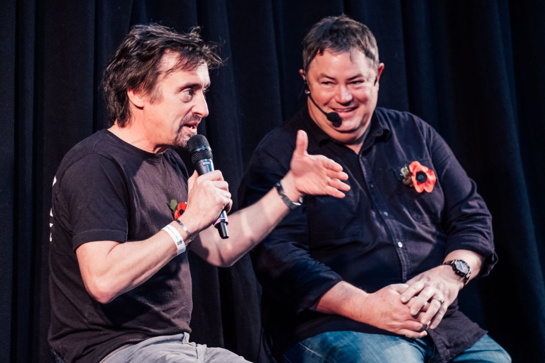 Richard Hammond and Mike Brewer on stage during an event, with both men wearing poppy pins.