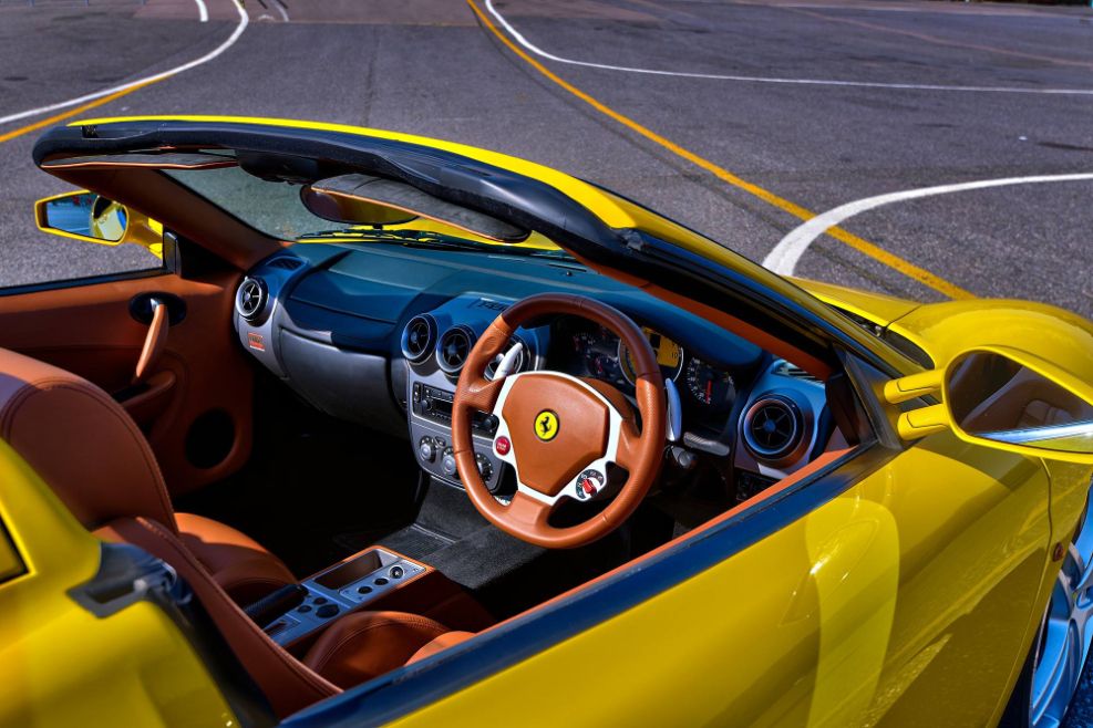 Yellow Ferrari F430 Spider interior tan leather steering wheel race track supercar