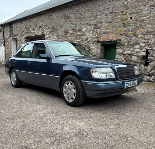 Dark blue Mercedes-Benz W124 Saloon in Ireland, classic 90s E-Class four-door.
