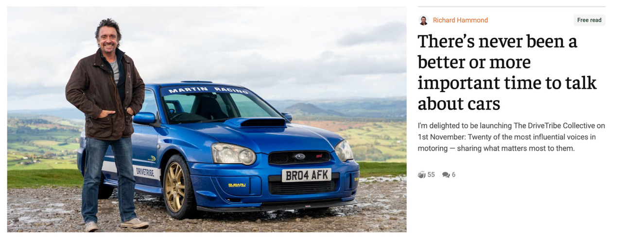  Richard Hammond standing next to a classic blue Subaru Impreza rally car with gold wheels, on a scenic hill for DRIVETRIBE.
