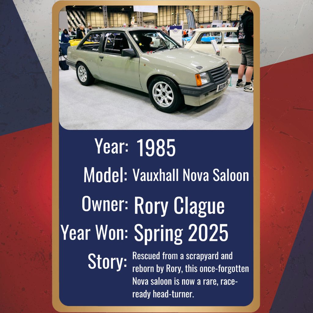 A classic, light gray 1985 Vauxhall Nova Saloon is the main subject of this image, captured from a low angle at an indoor motor show. The vintage car is in excellent condition, with a clean design and sporty multi-spoke alloy wheels. A license plate is visible, reading 