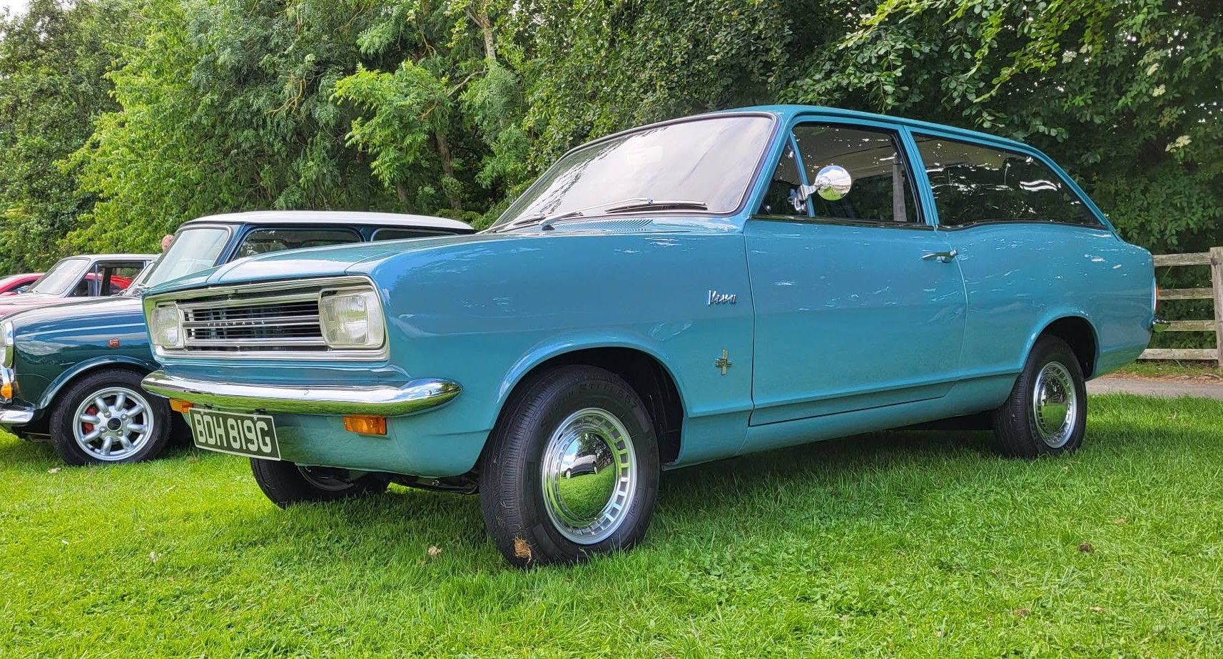 Vintage light blue Vauxhall Viva HB Estate parked on the grass at an outdoor classic car show