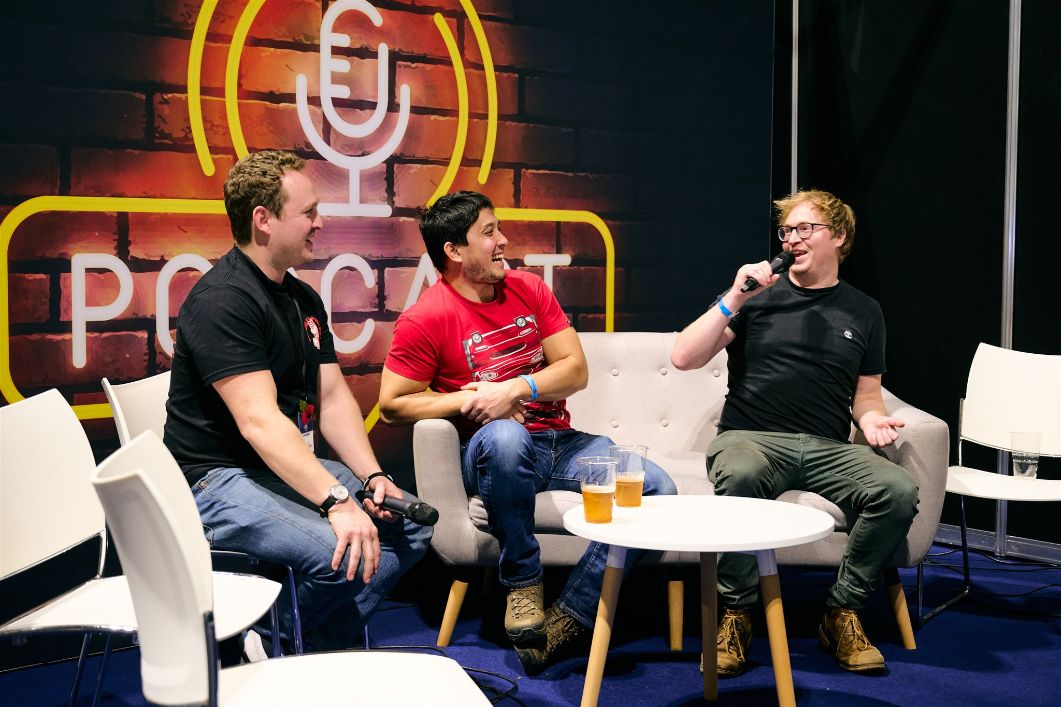 Auto Alex and team podcasting live at the Classic Motor Show's Podcast Lounge, engaging with enthusiasts.
