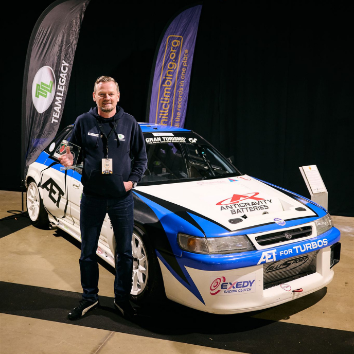 Modified white and blue Subaru Legacy hillclimb race car featuring AET Turbos and Exedy Racing Clutch livery.