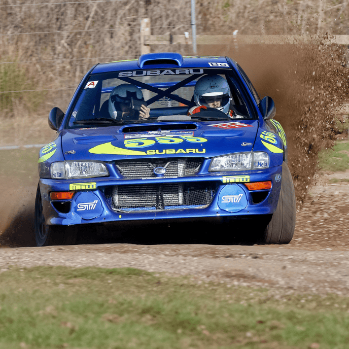 Blue Subaru Impreza WRC rally car mud spray racing motorsport all-wheel-drive