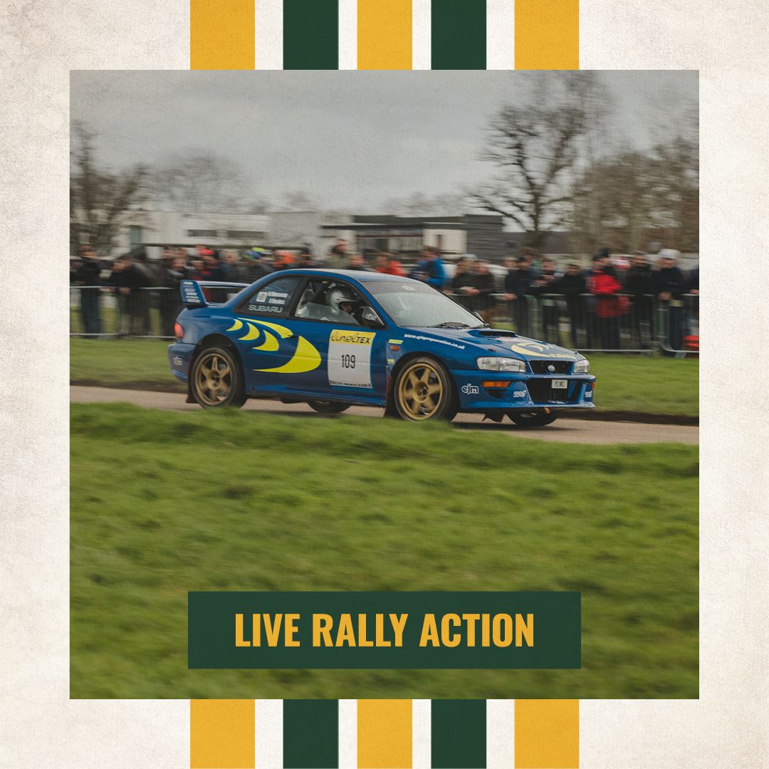 Subaru Impreza 555 rally car driving at high speed on a track during a live rally action demonstration.