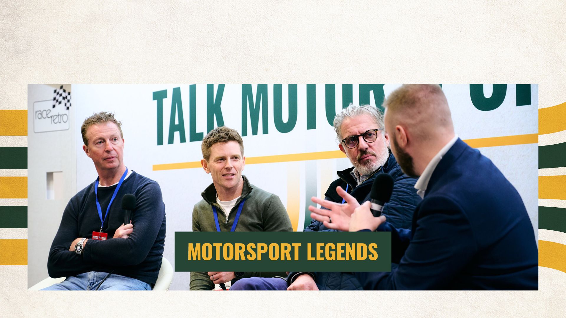 Expert panel of motorsport legends and drivers speaking during a live interview session at a racing event stage.