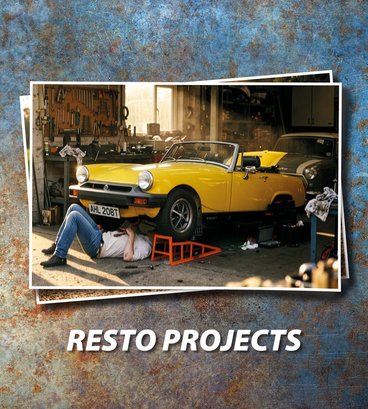 Yello MG Midget in a garage, with man under car working on engine.