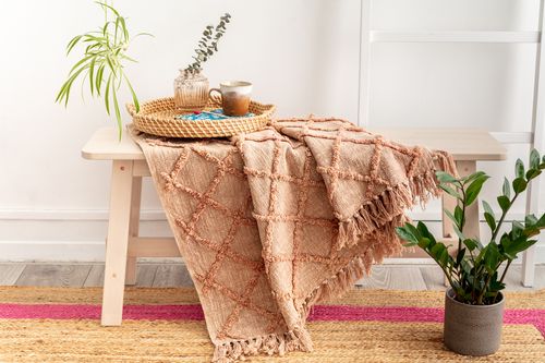 Textured dusty pink throw