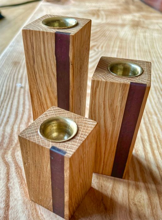 Trio of english hardwood candlesticks