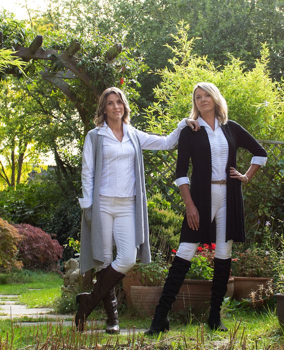 White cotton shirts, soft jumpers, cardigans and ponchos