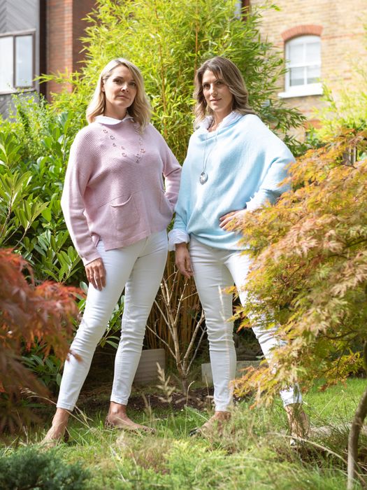 White cotton shirts, soft jumpers, cardigans and ponchos