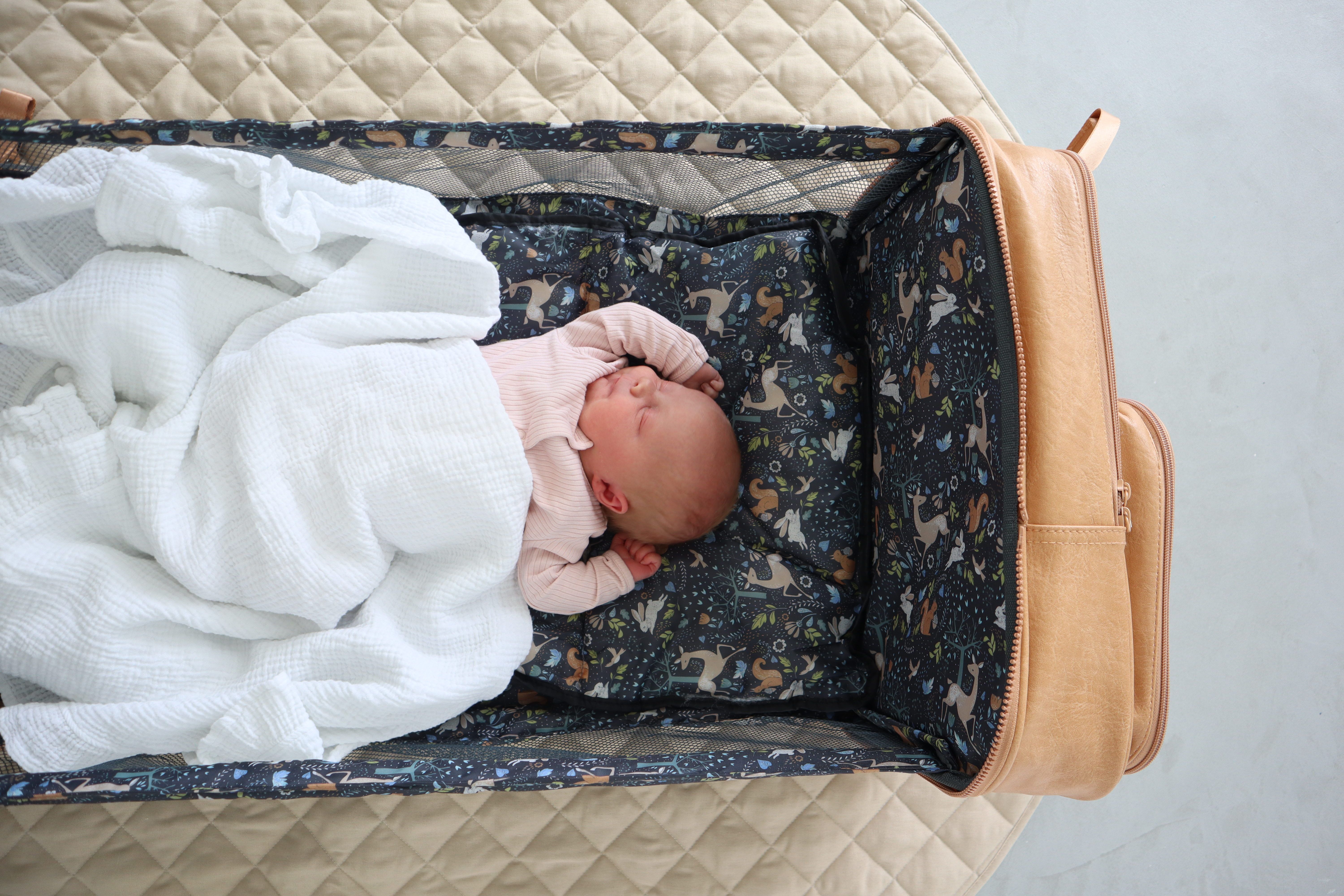 The Vegan leather Rucpod travel crib