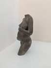 sculpture in aged bronze