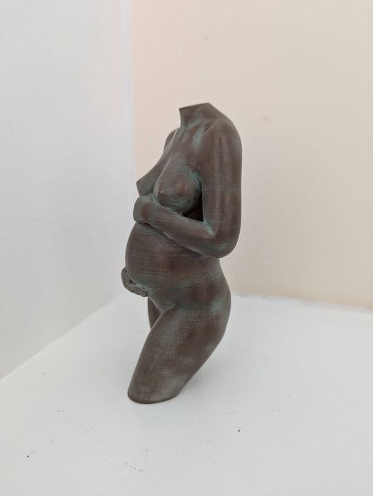 sculpture in aged bronze