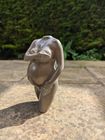 sculpture in aged bronze