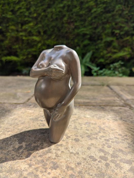 sculpture in aged bronze