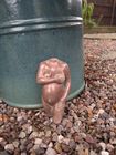sculpture in aged copper