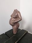 sculpture in aged copper