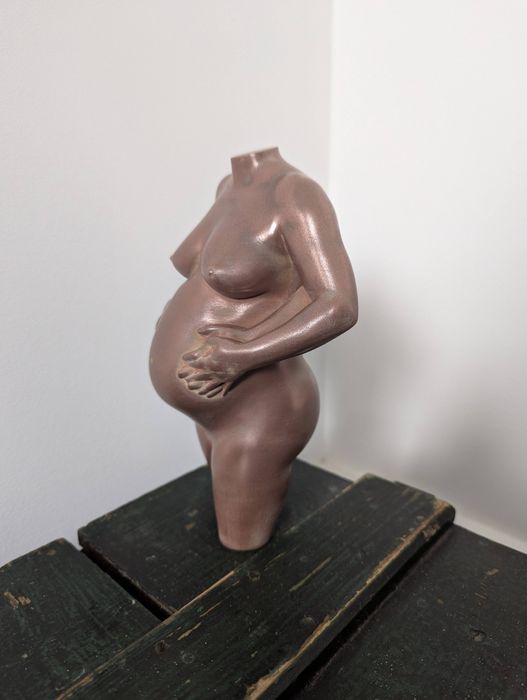 sculpture in aged copper