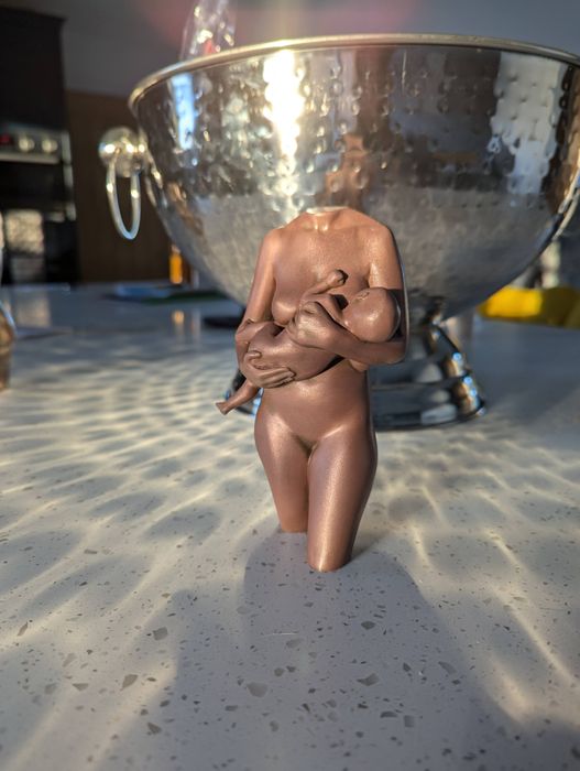 sculpture in polished copper
