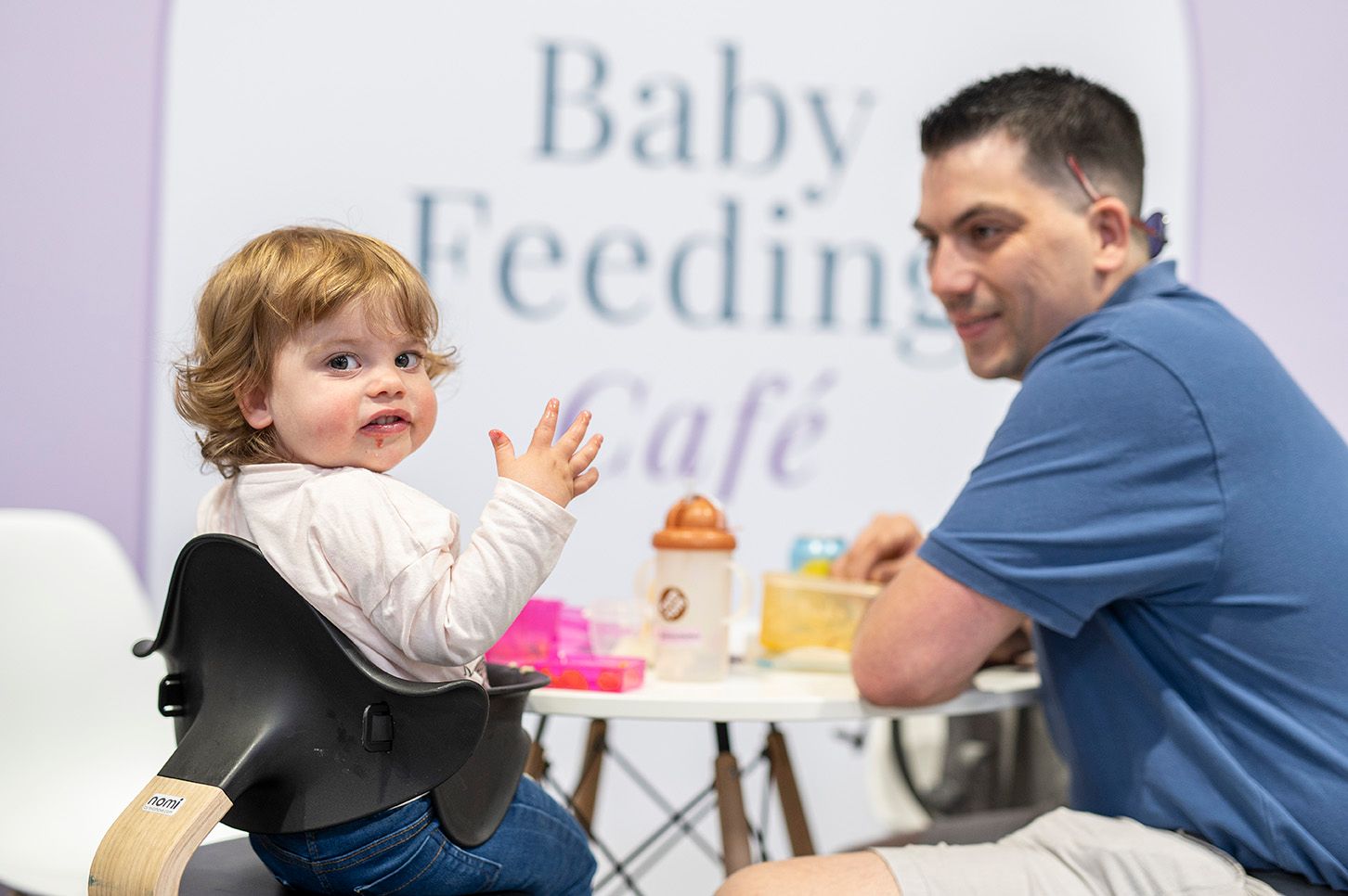 man feeding child