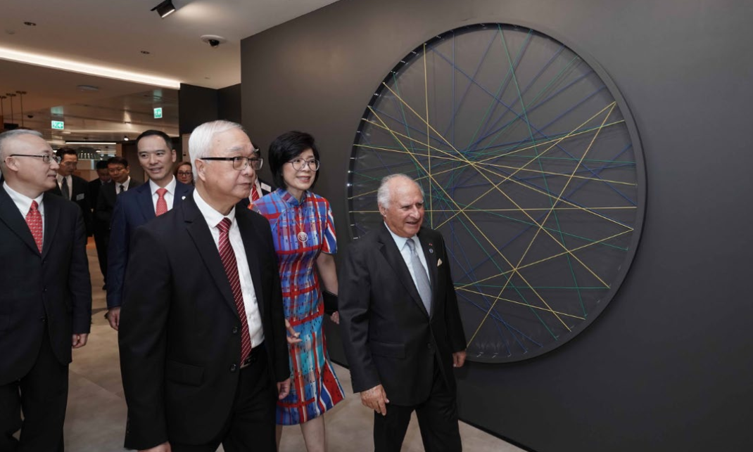 CLP Holdings Chairman the Honourable Sir Michael Kadoorie (first from right) leads guests to a tour of the new CLP Headquarters following the grand opening ceremony.