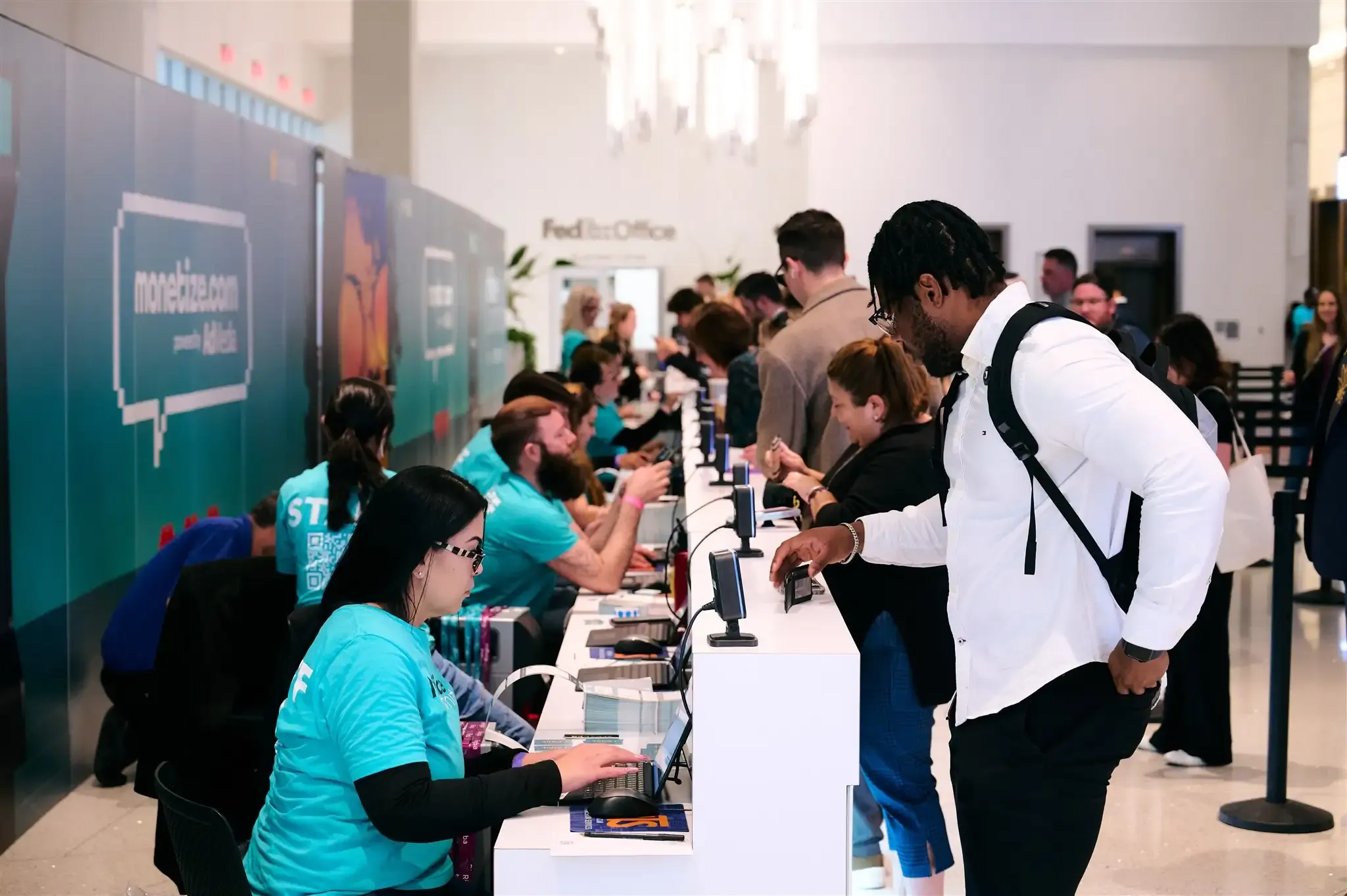 Attendees collecting their ticket at ASW26