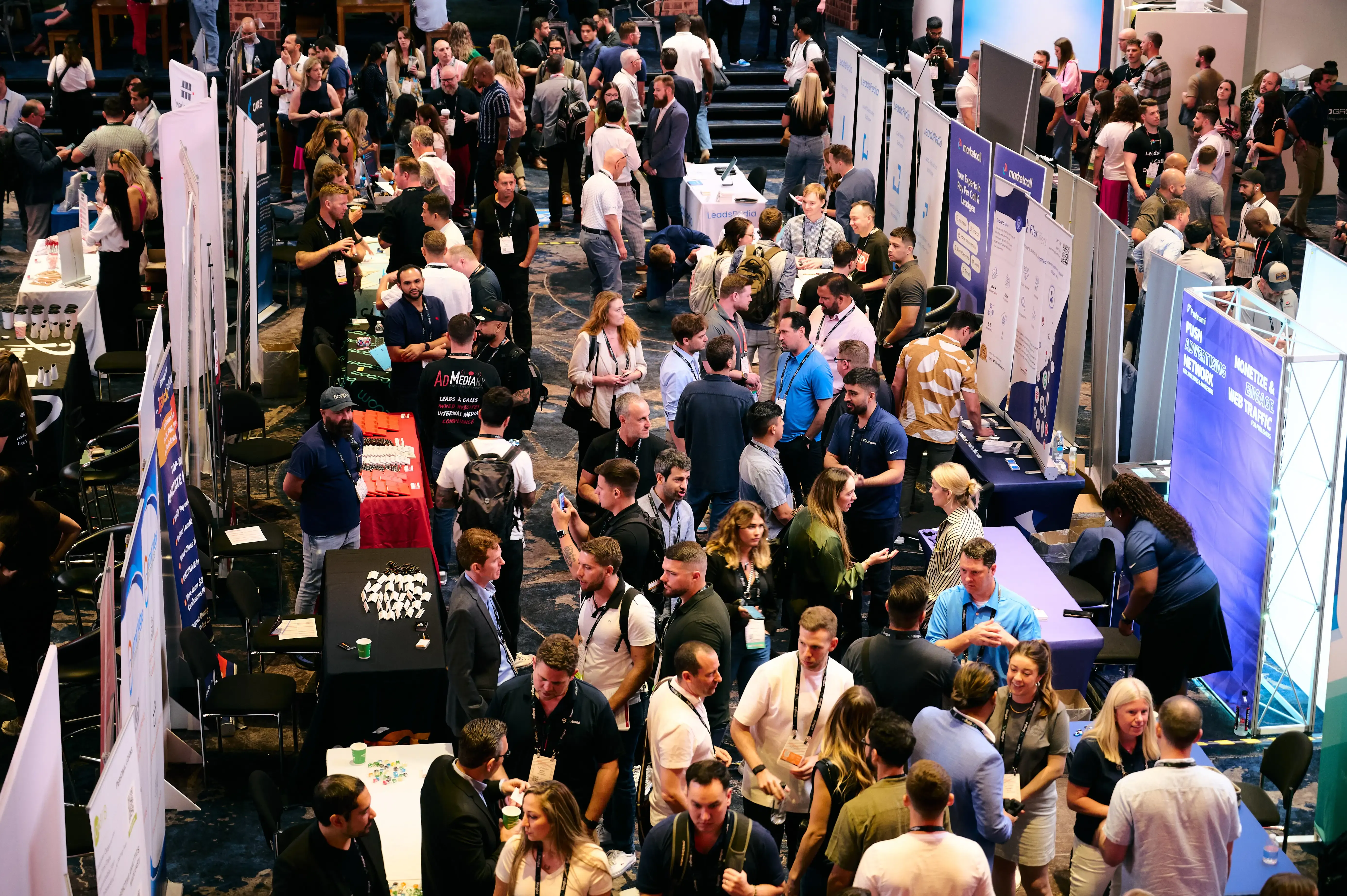 A busy crowd networking in the Meet Market at Affiliate Summit East 