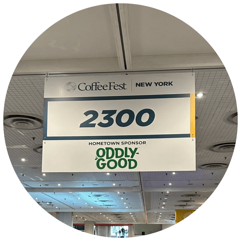 Oddly Good logo on Exhibition Hall Aisle Signs