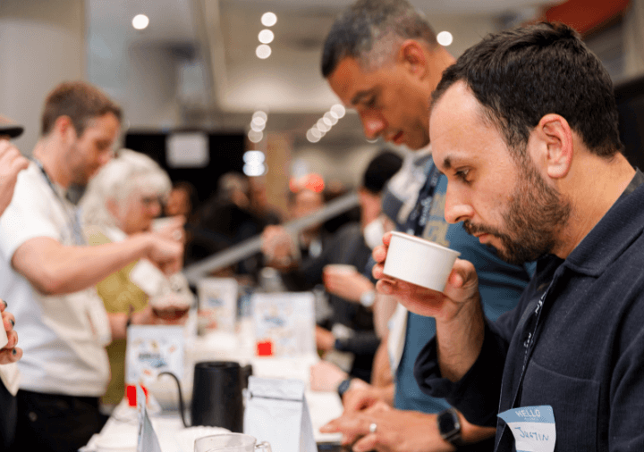 Attendee during cupping class in the Cupping Corner on the show floor at Coffee Fest