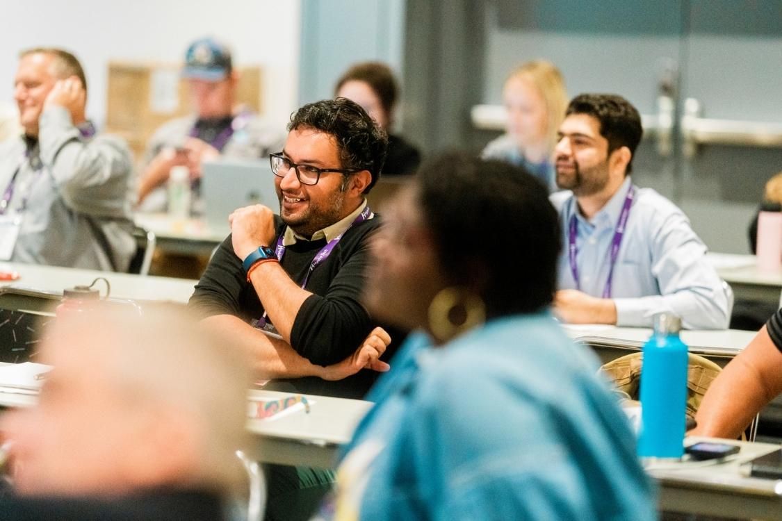 Attendees sitting in on a conference session