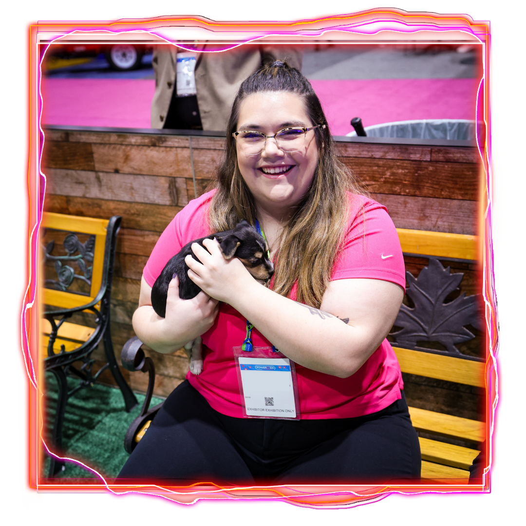 Woman Holding Puppy at POWERGEN International