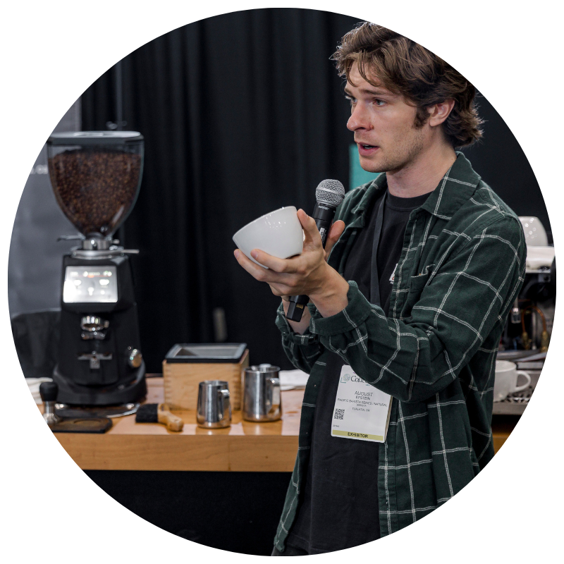 Speaker holding mug and instructing a session
