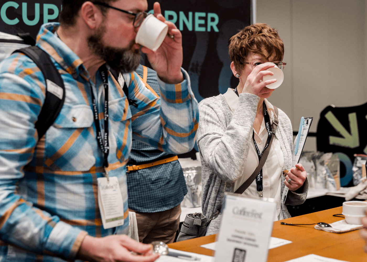 Two attendees during a session in the Cupping Corner