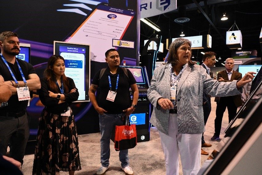 Attendees Chatting on Show Floor