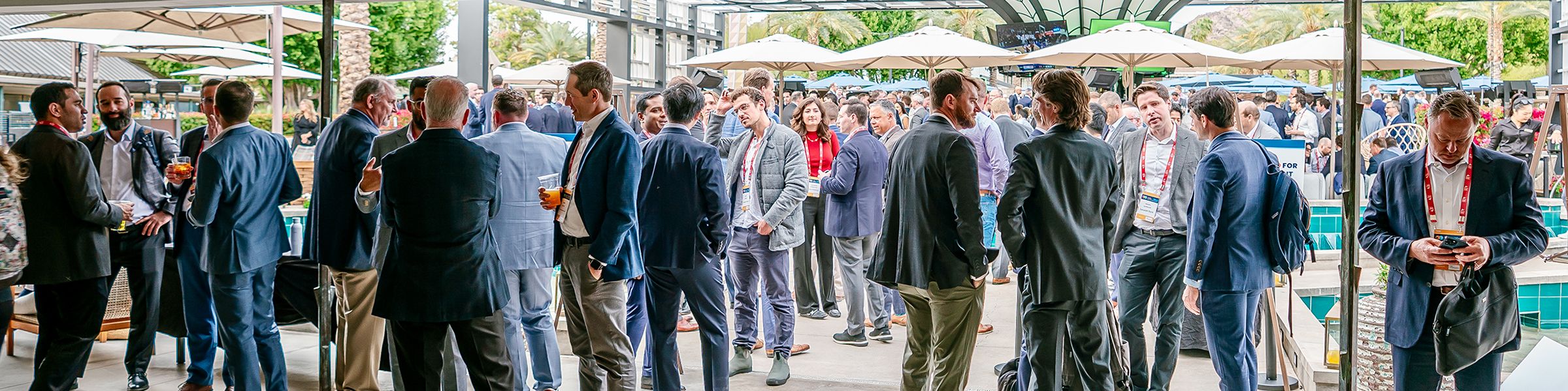 Many business professionals networking at an Infocast event