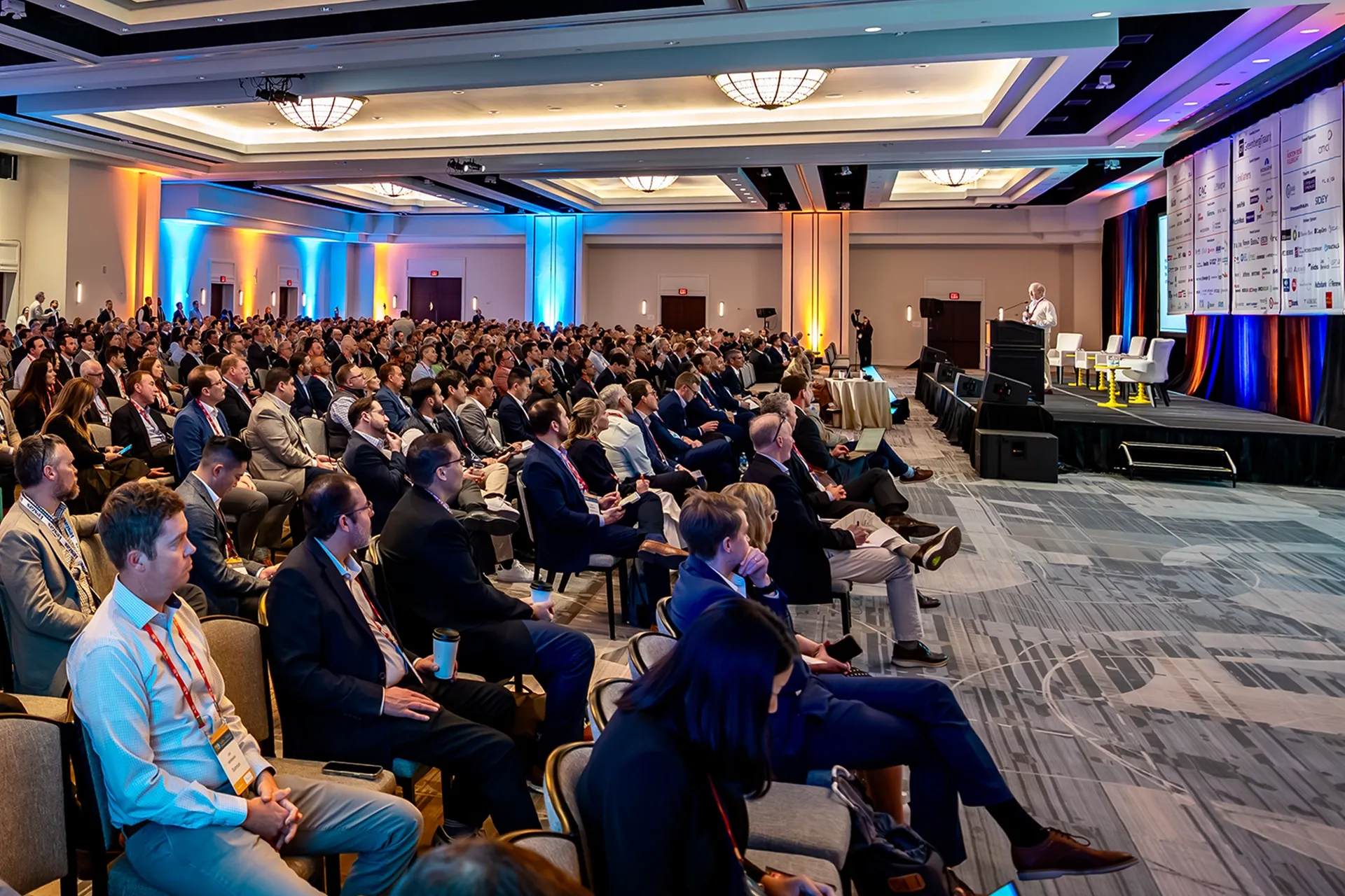 Speaker Keith Martin on stage delivering his presentation in front of many attendees