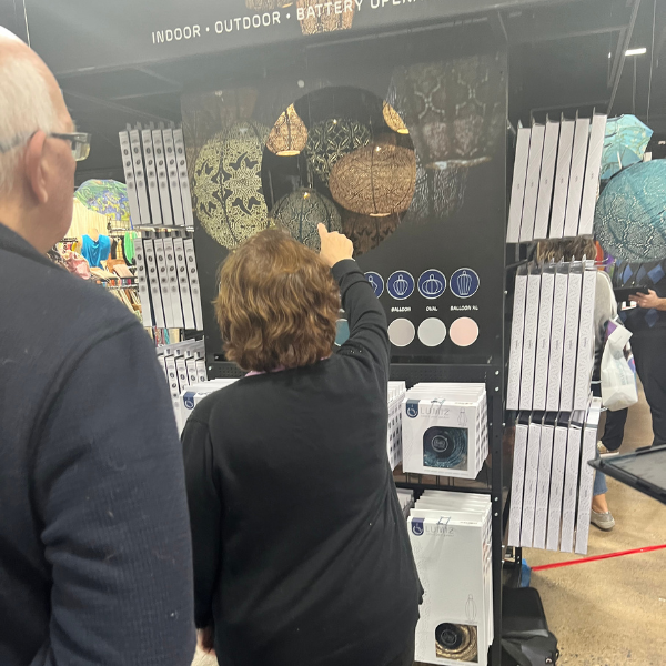 Buyer pointing at product