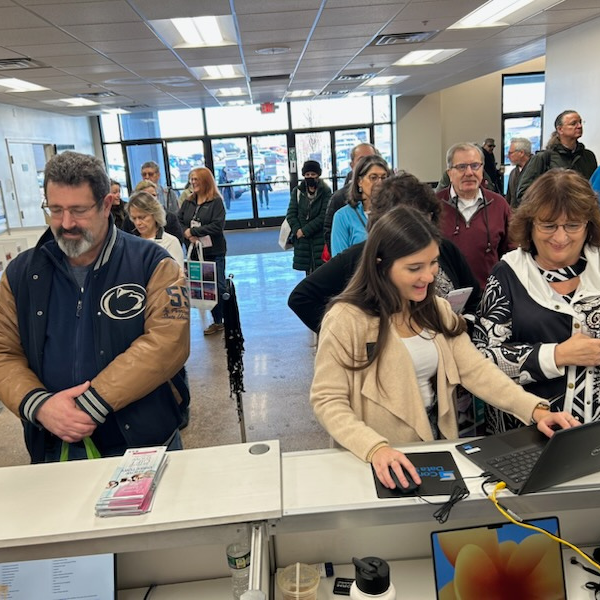 Buyers standing at registration