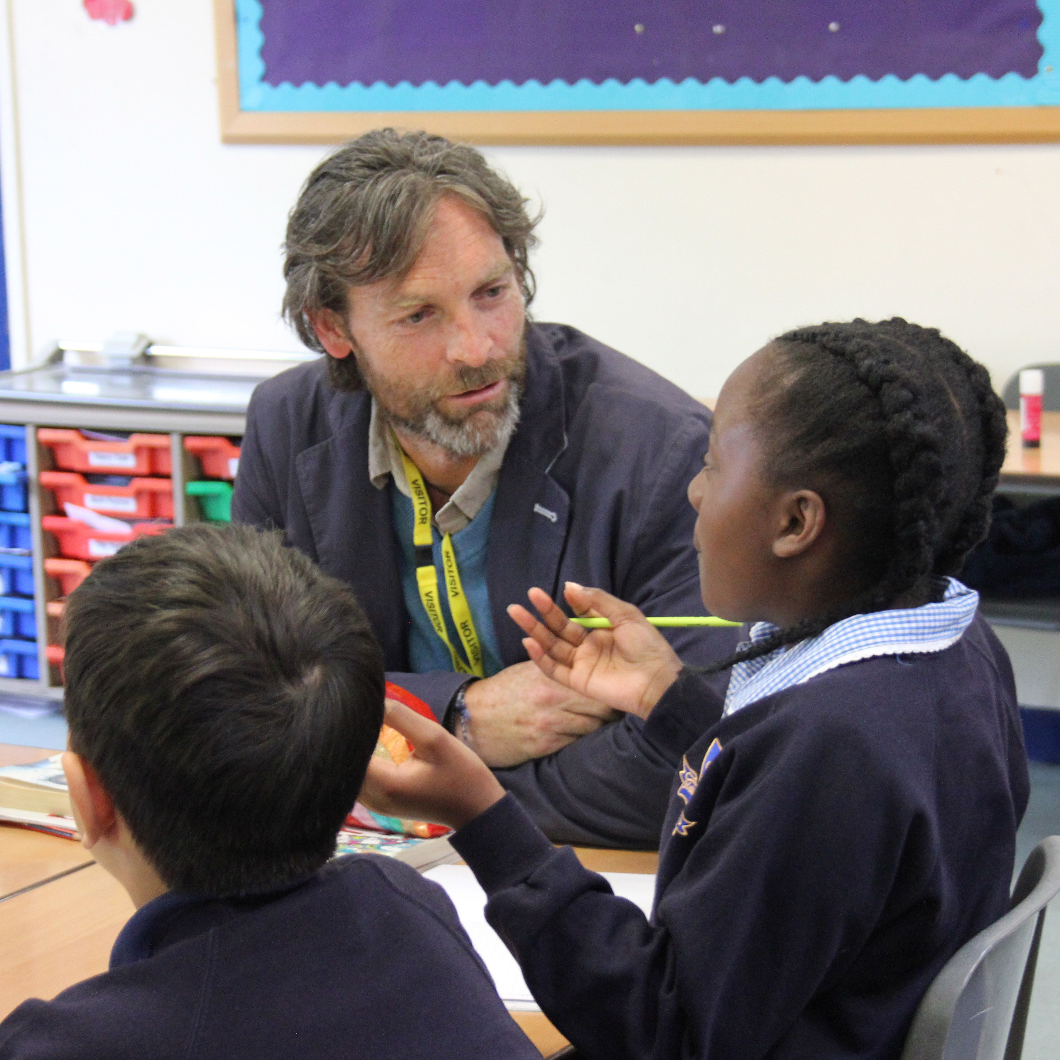 evan with children in school