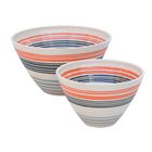 Large and small hand-thrown salad bowls decorated with orange, black and grey carved bands